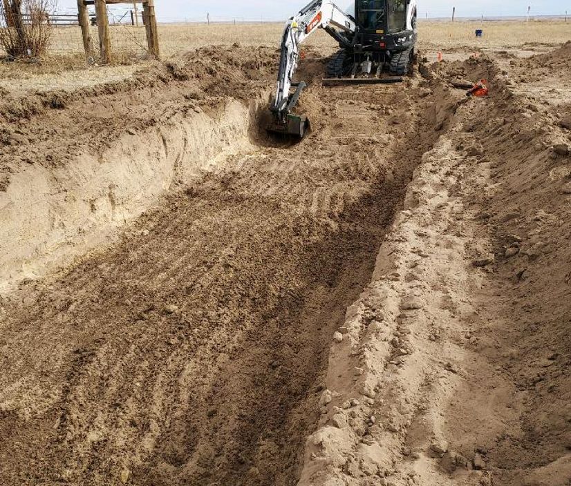 excavator digging trench